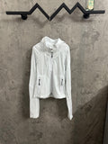White zip-up jacket with hood and drawstring toggles, long sleeves, front pockets