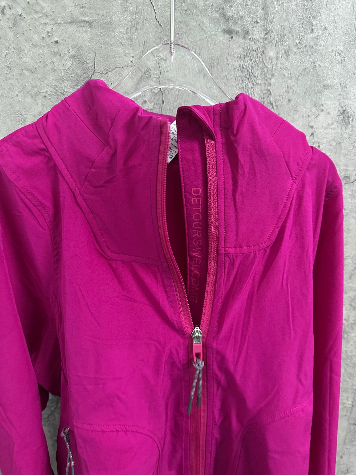 Ralph Lauren clothing: fuchsia hooded jacket front with full-length zipper close-up