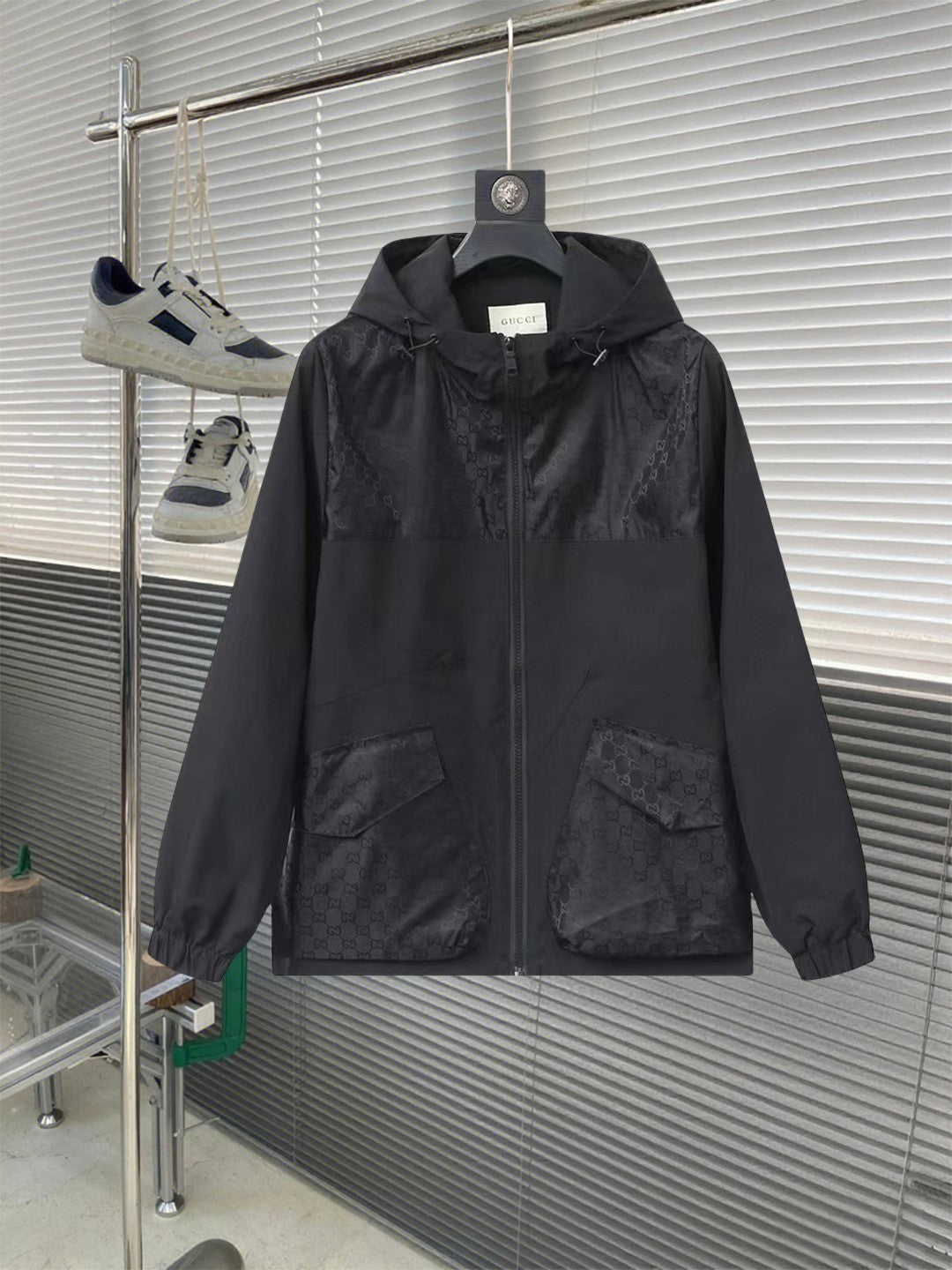 Gucci hooded jacket in dark black with full front zipper and flap pockets