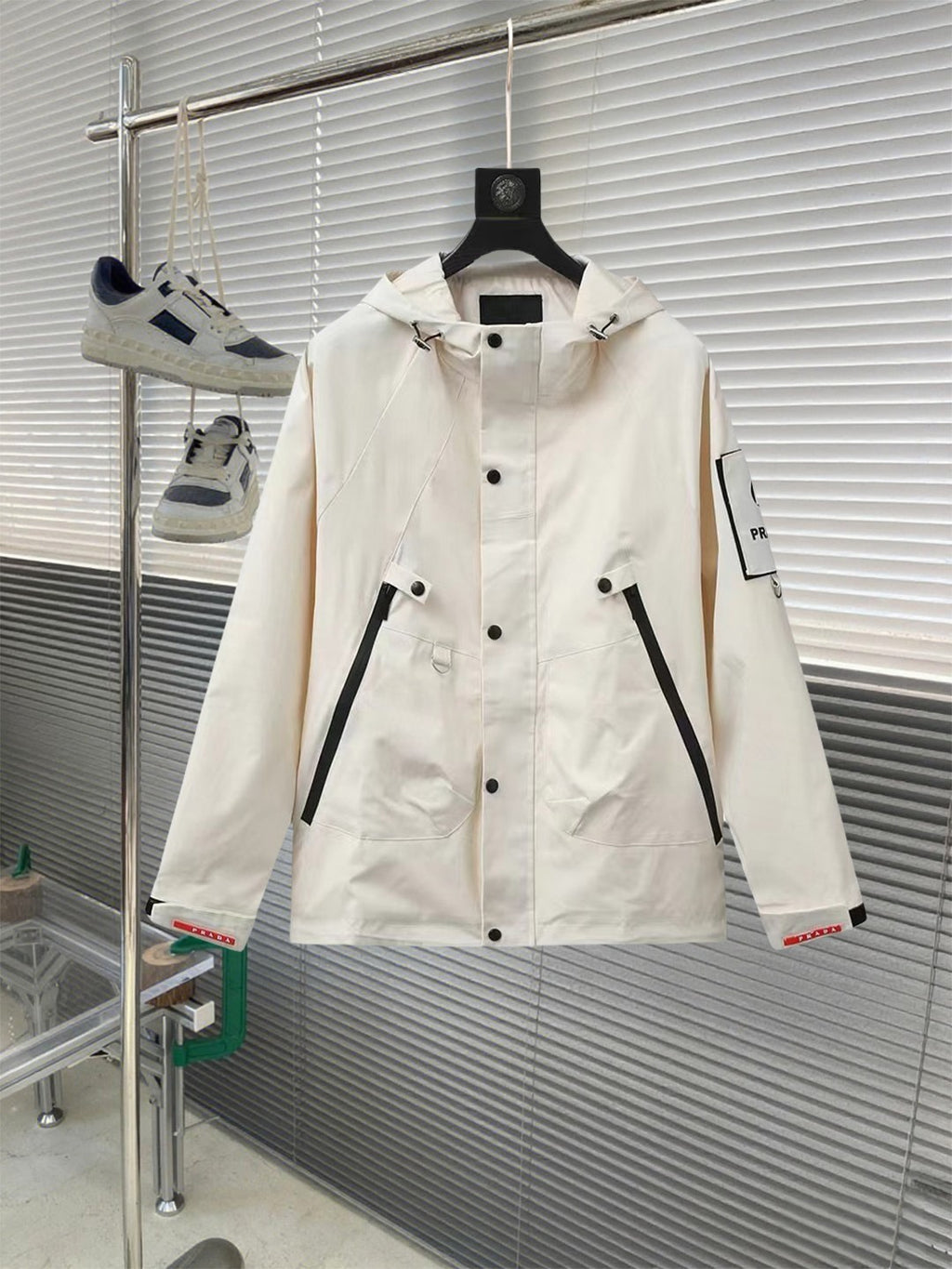 Prada long white jacket with button front, hood, and black-trim pockets