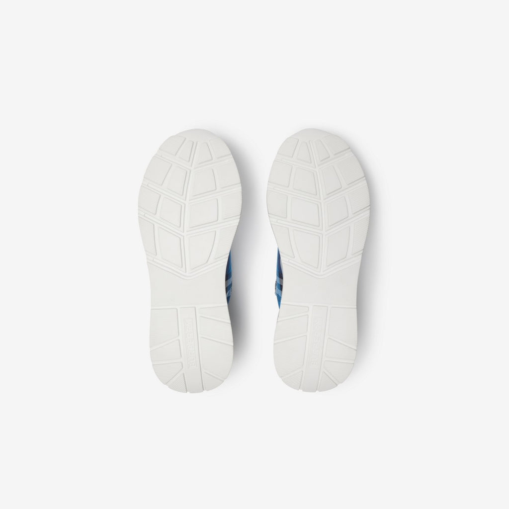 Burberry sneakers outsole view with tread pattern and white rubber base