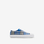 Blue and white plaid low-top sneakers with white sole and lace-up closure