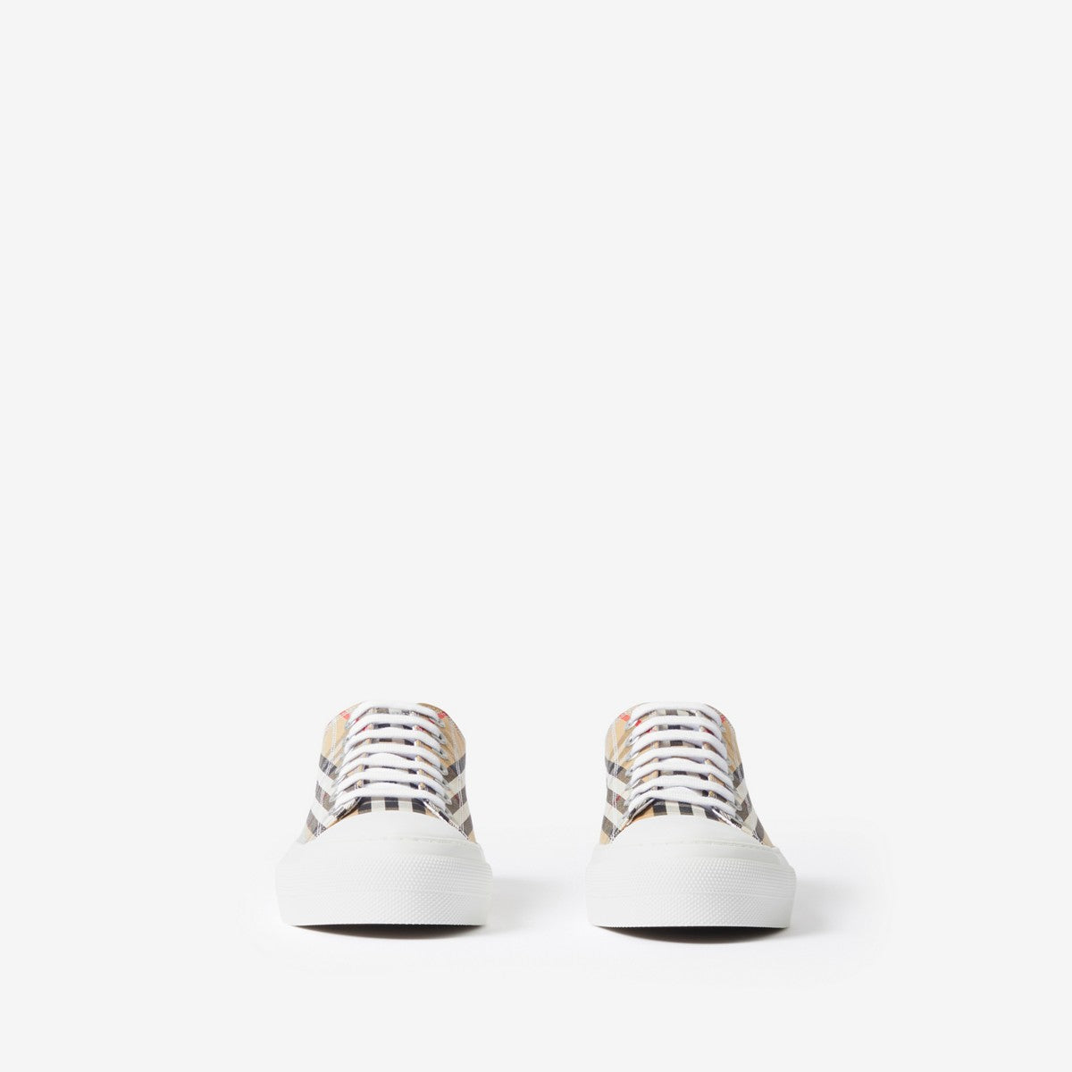 Pair of low-top sneakers with beige plaid uppers and white lace trim