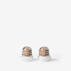 Pair of low-top sneakers, beige plaid heel panels with embossed sole text