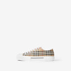 Low-top sneakers with beige plaid canvas upper and white sole with logo lettering
