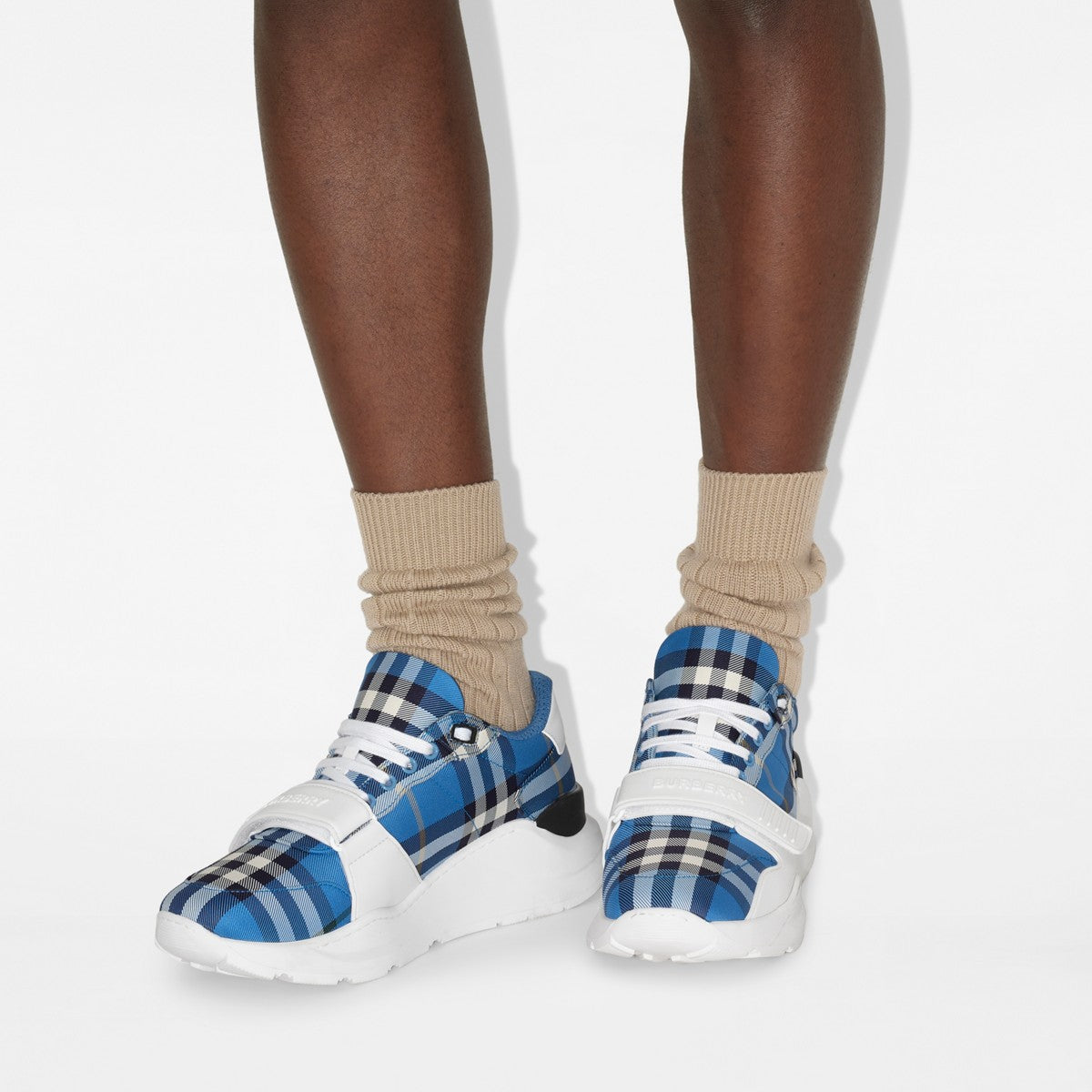 Burberry check sneakers with beige socks, blue plaid uppers and white sole