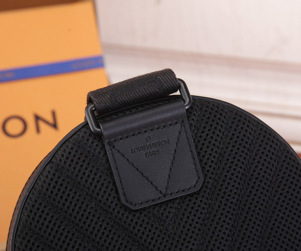 Black Louis Vuitton bag interior label patch on textured leather with strap tab