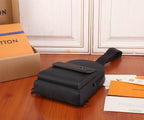 Black Louis Vuitton compact bag with flap, top handle, and adjustable shoulder strap