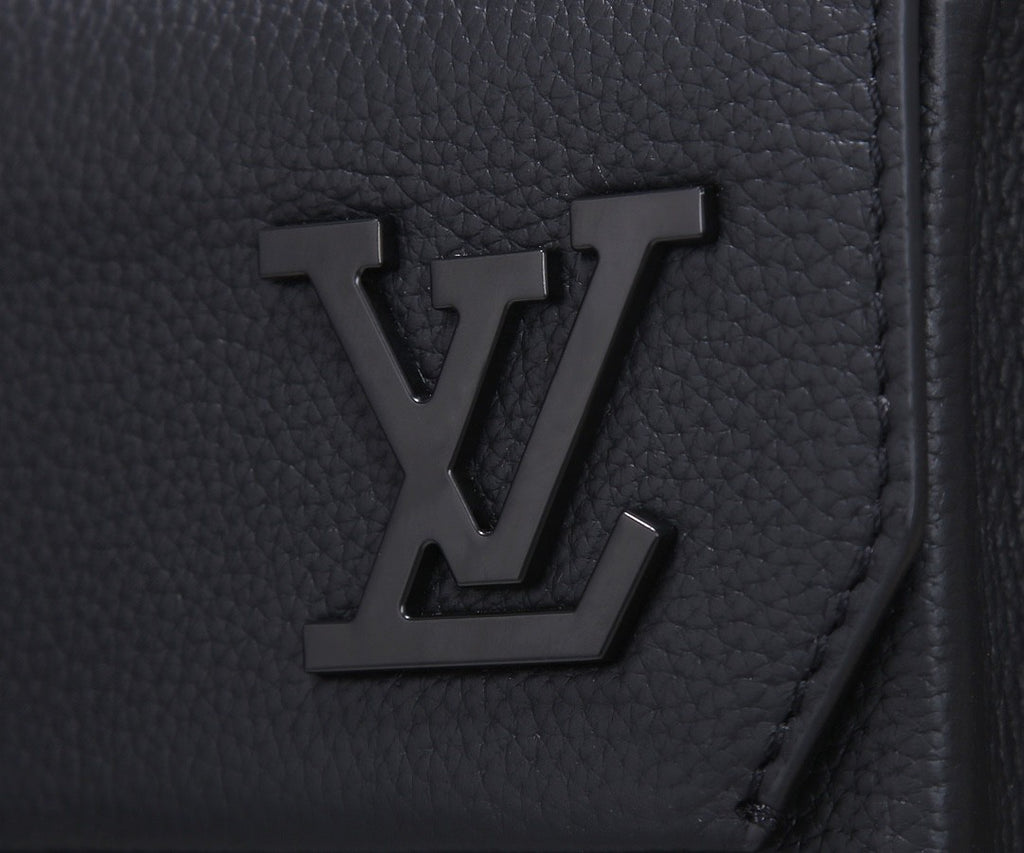 Louis Vuitton men’s black leather backpack with embossed LV logo on front panel