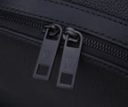 Louis Vuitton men’s backpack zipper close-up with two metal pull tabs