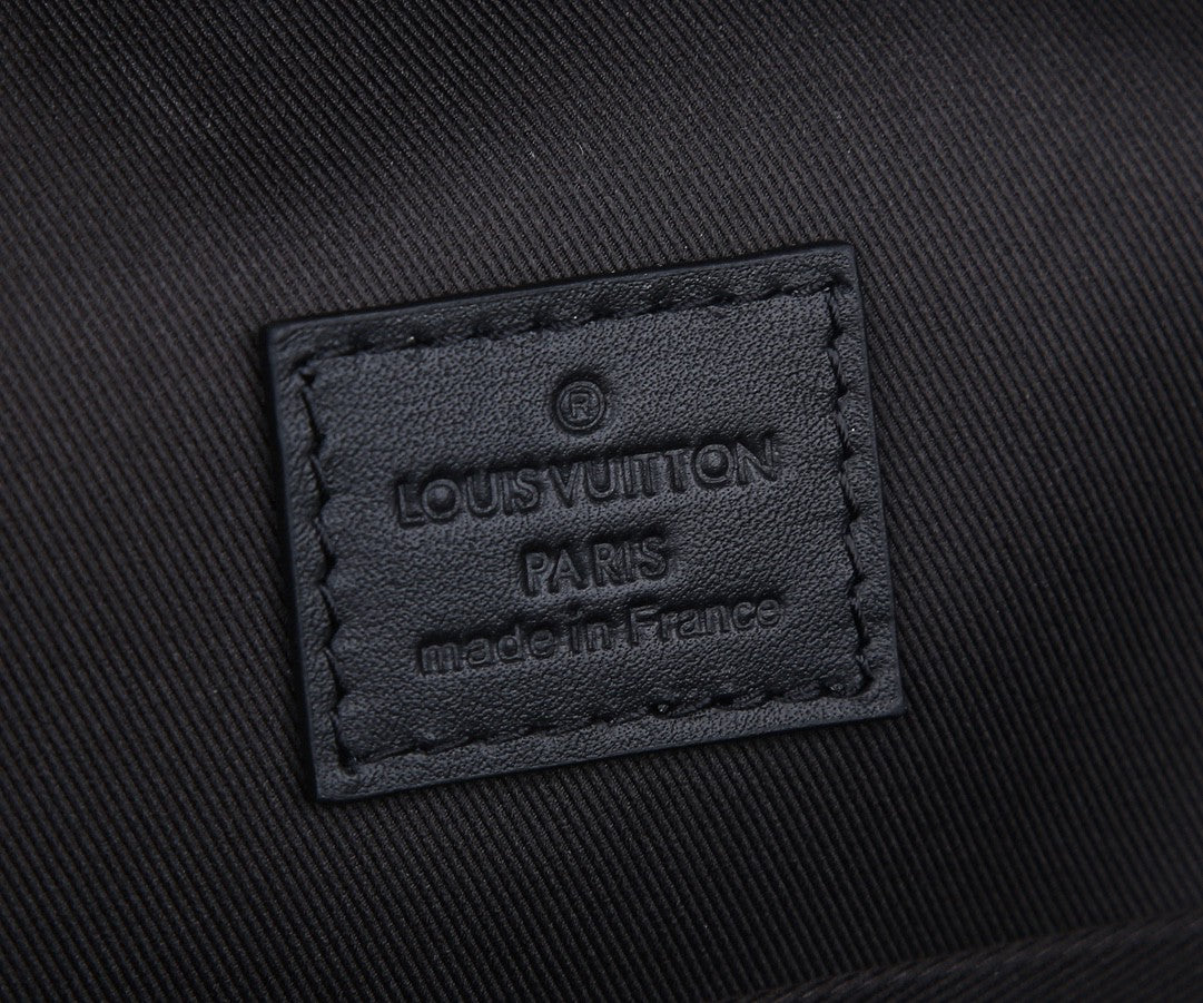 Louis Vuitton men’s backpack fabric label patch reading Louis Vuitton Paris made in France
