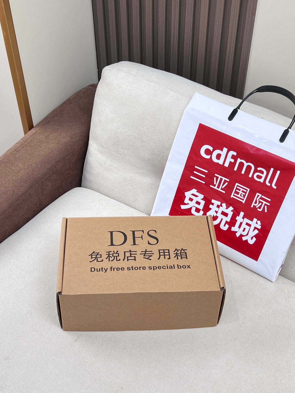 Coach DFS duty-free special box and shopping bag on couch