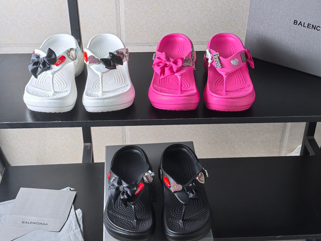 Set of sandals in white and hot pink with bow straps and heart patches