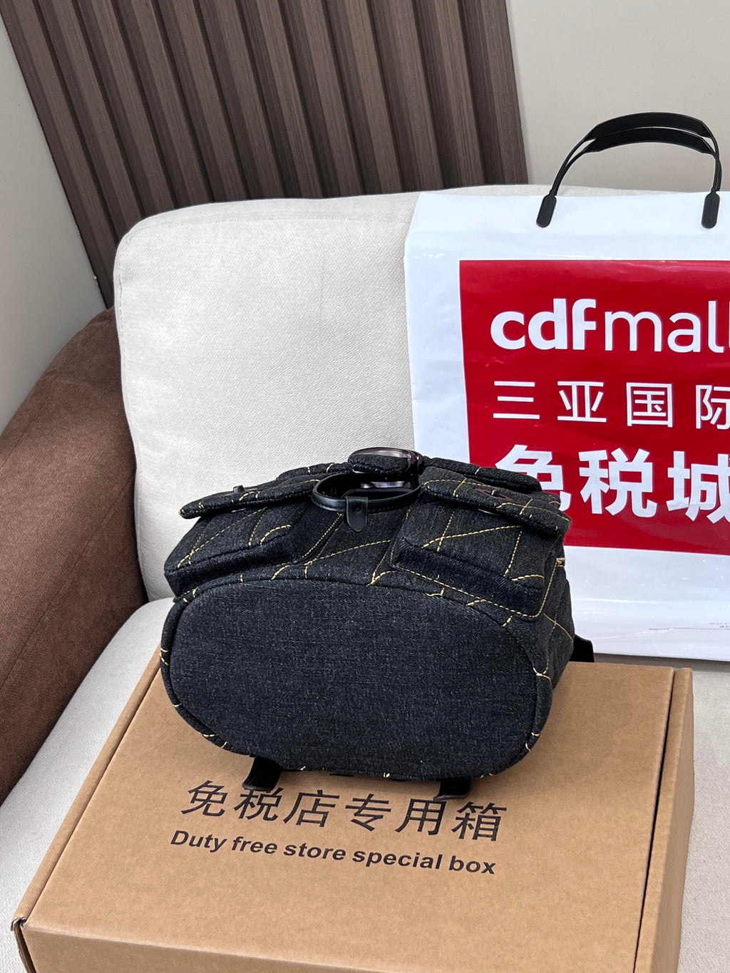Coah bag dark denim mini crossbody with top handle and front flap closure