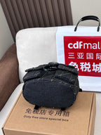 Coah bag dark denim mini crossbody with top handle and front flap closure