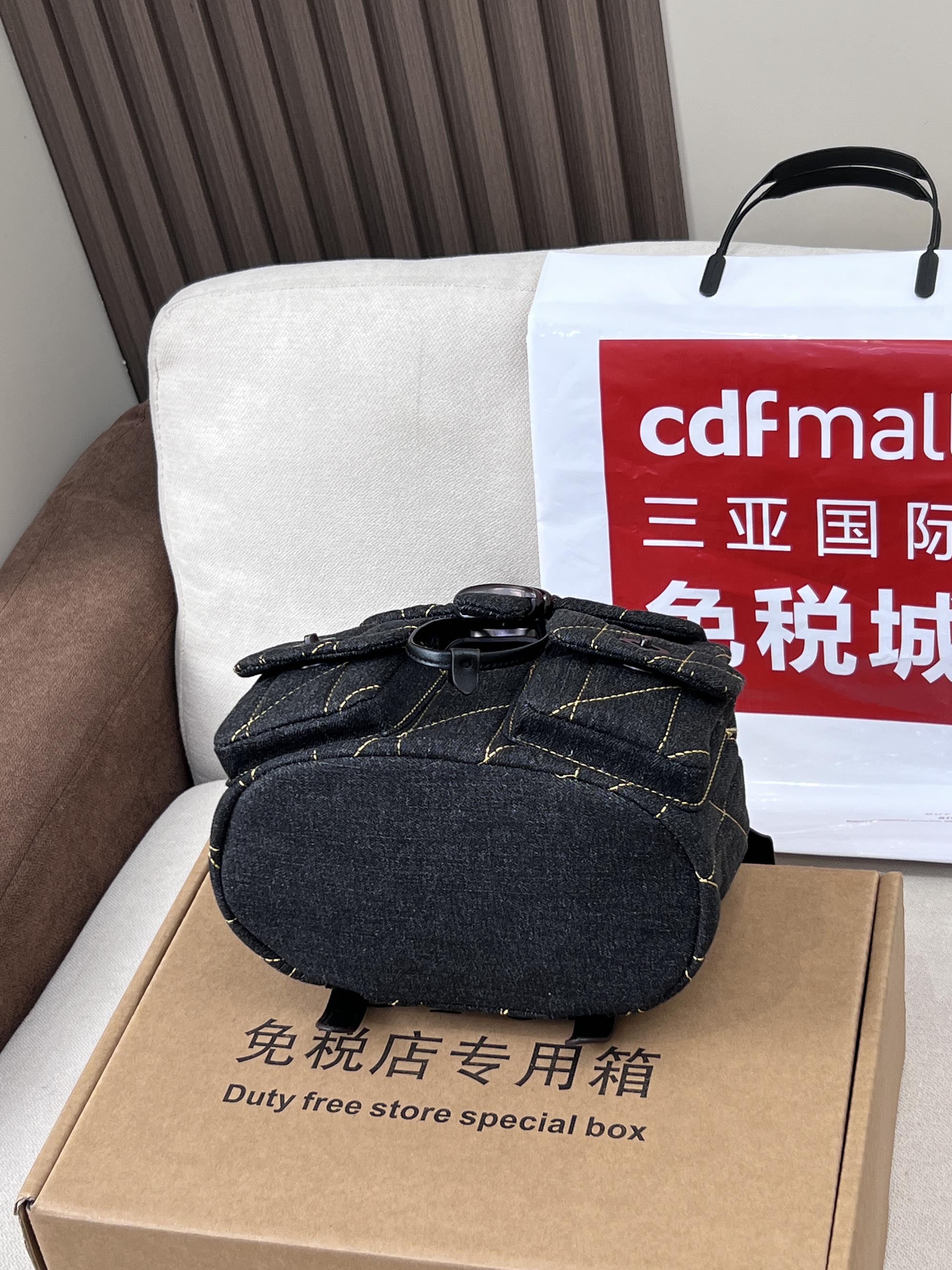 Coah bag dark denim mini crossbody with top handle and front flap closure