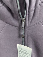 Zip-up hoodie zipper and metal pull with care label