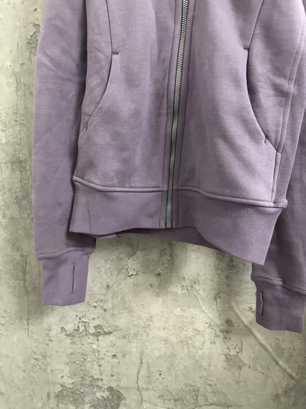 Purple zip-up hoodie front with kangaroo pocket and ribbed cuffs