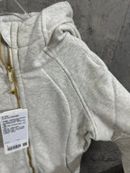 Heather gray zip-up hoodie hood and drawstring with gold zipper detail