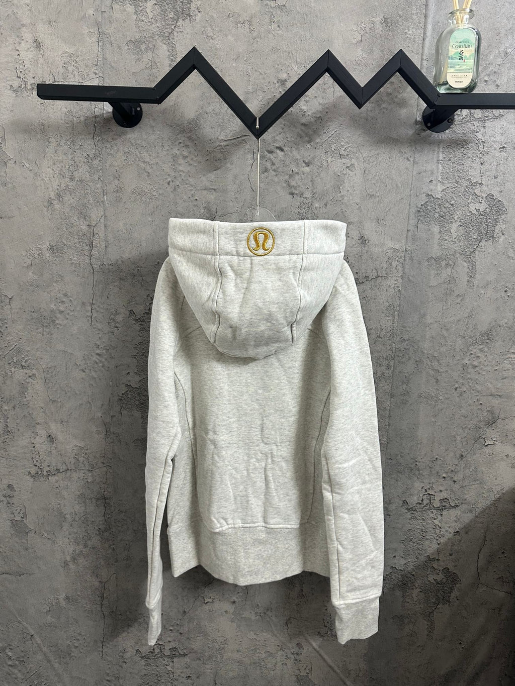 Heather gray zip-up hoodie with hood, kangaroo pocket, and gold zipper