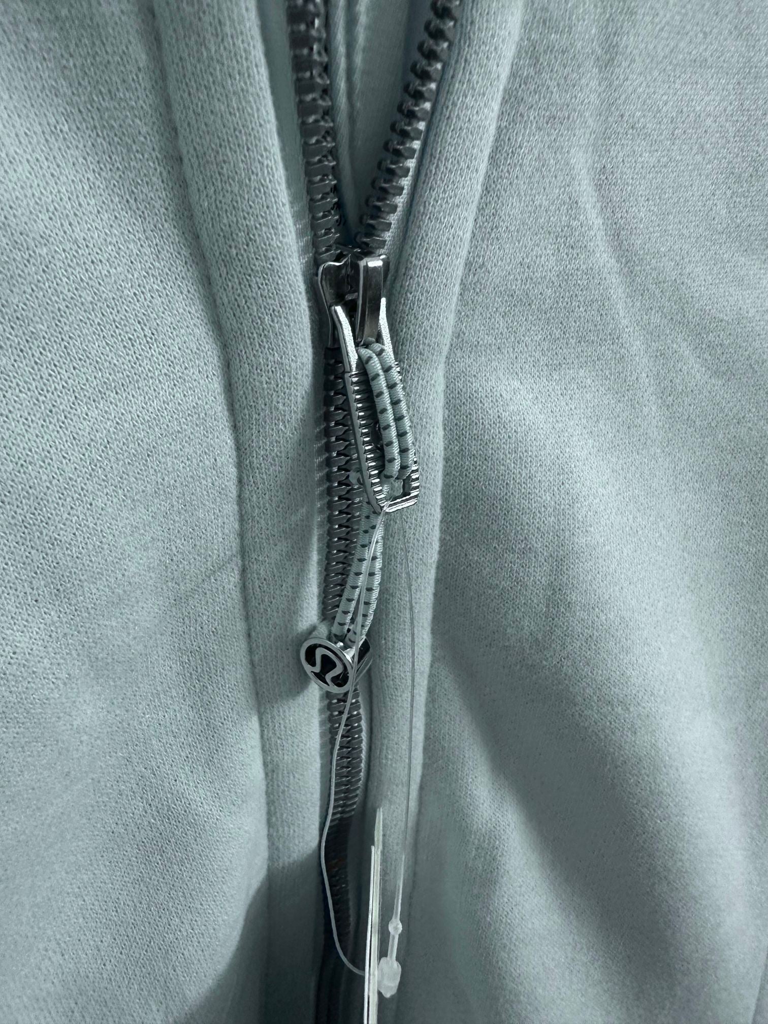 Light blue zipper on front of hoodie