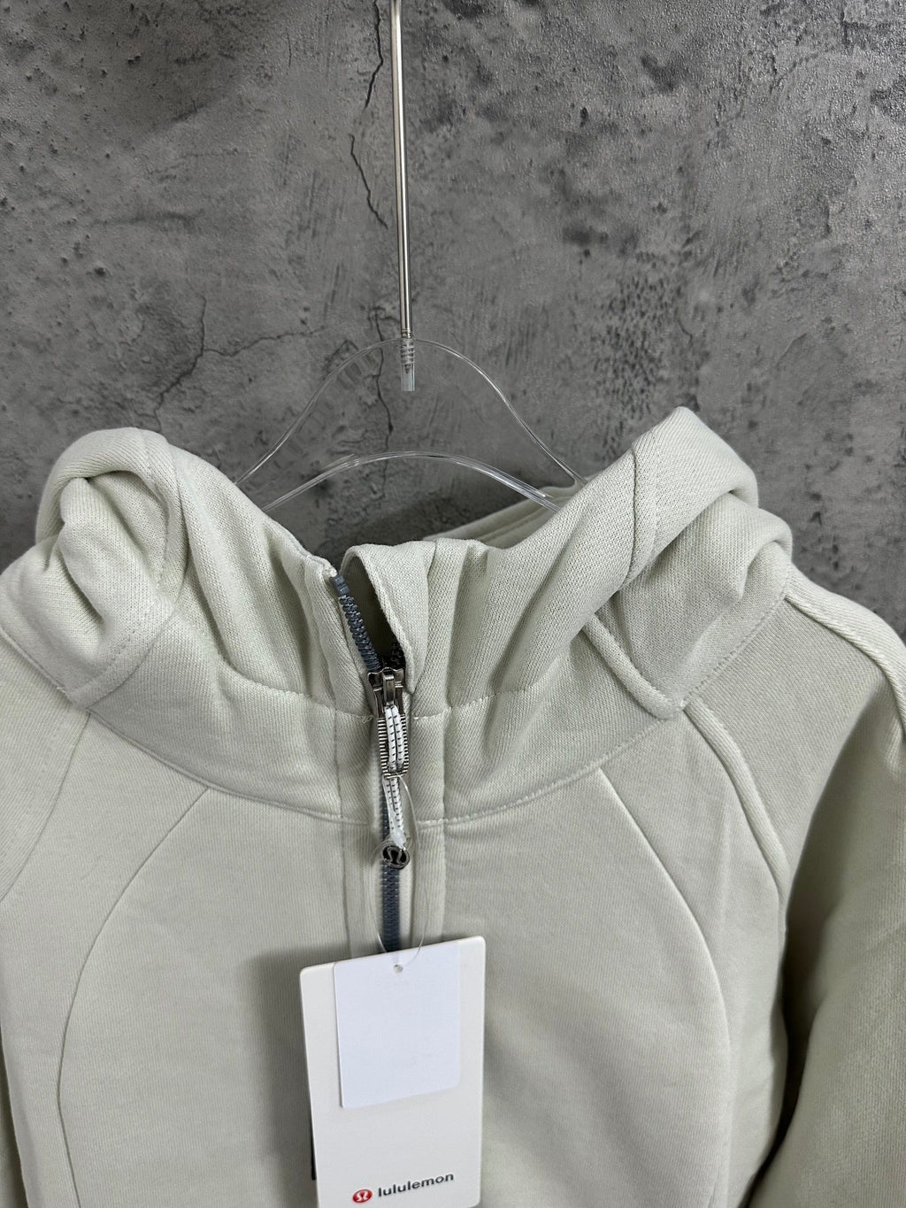 Off-white zip-up hoodie hood with metal zipper and drawstring detail