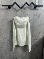 Off-white zip-up hoodie with hood and back view, ribbed cuffs and hem