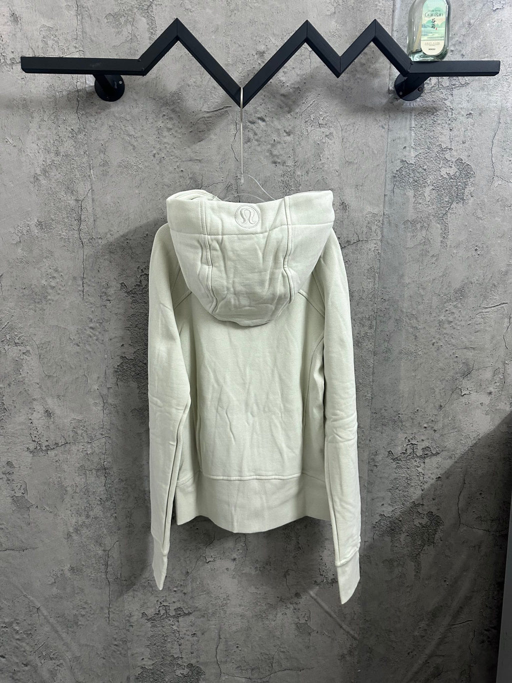 Light cream hooded zip jacket, back view with attached hood