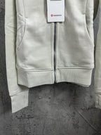 Light cream hoodie bottom hem with front zipper center seam
