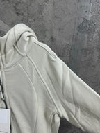 Light cream hoodie shoulder and hood close-up
