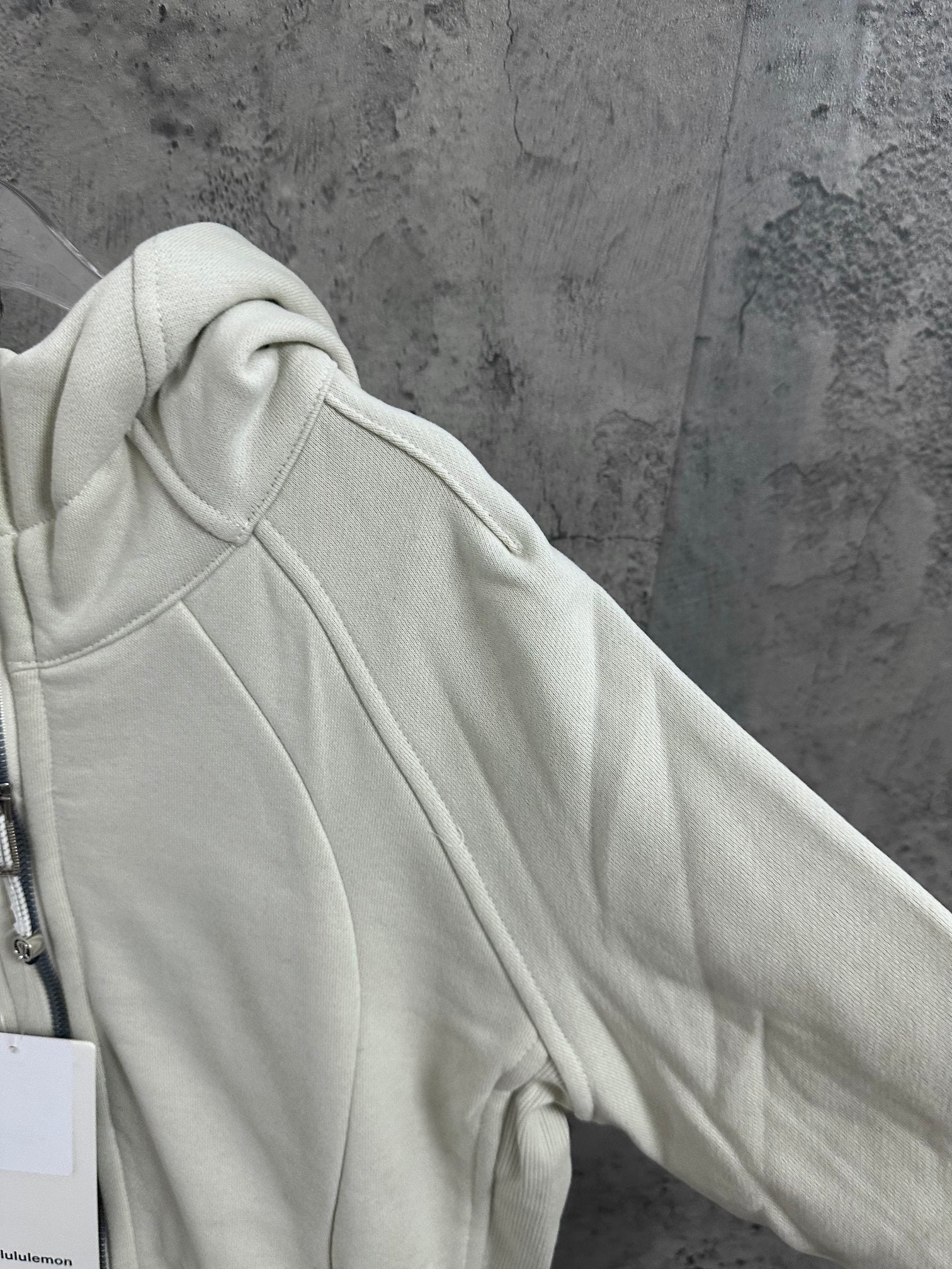 Light cream hoodie shoulder and hood close-up