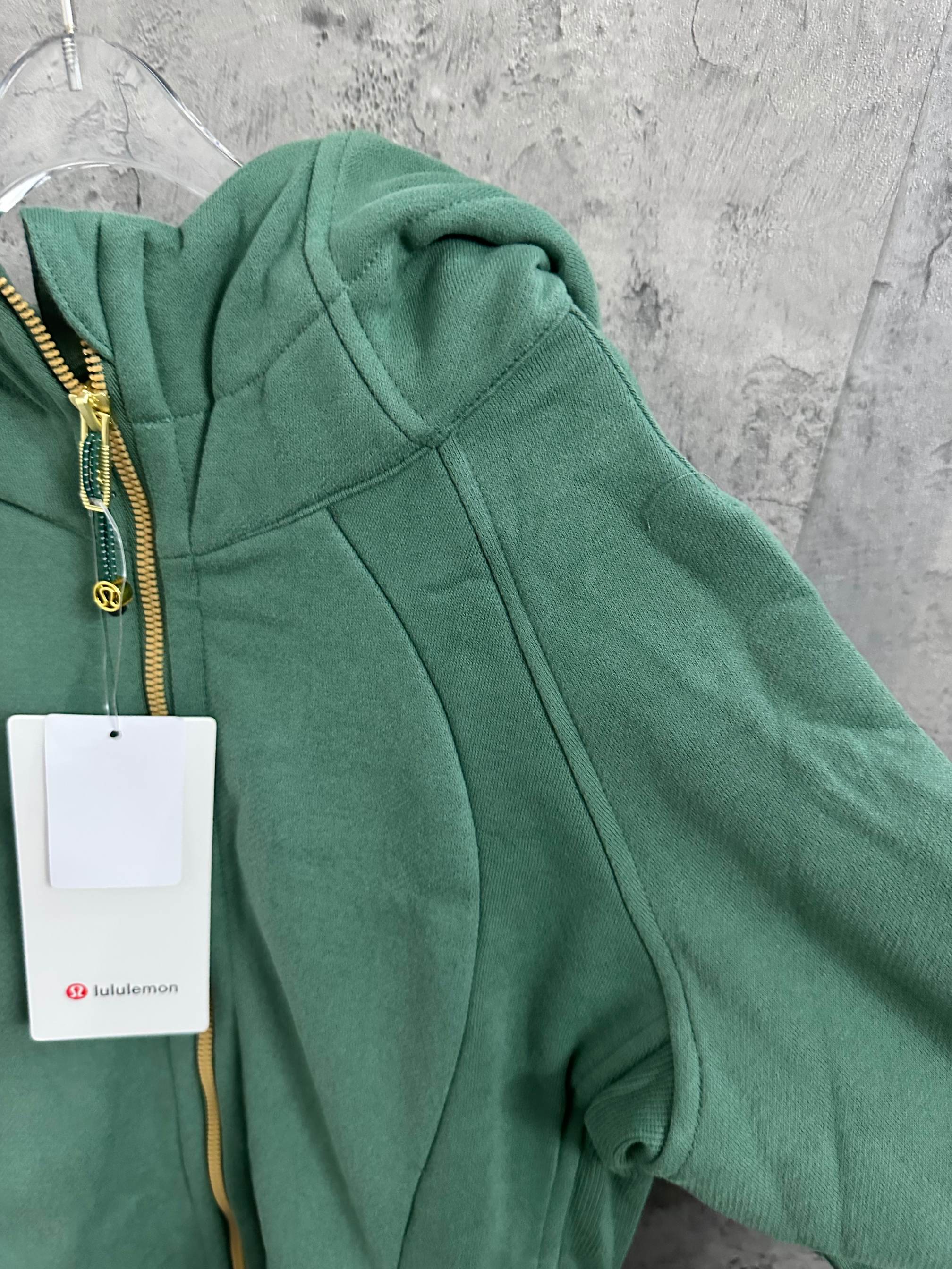 Green zip hoodie with hood and draped front seams