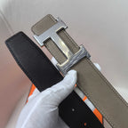 Leather belt with silver H buckle, taupe and black sides with stitched edges