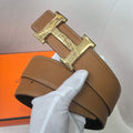 Brown leather belt with gold geometric buckle and stitched edge