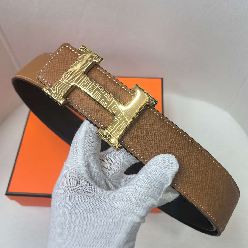Brown leather belt with gold buckle and curved strap end