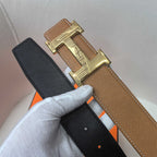 Two-tone belt: brown leather with gold buckle and dark leather keeper