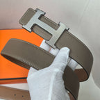 Brown leather belt with silver H buckle and stitched strap with two holes