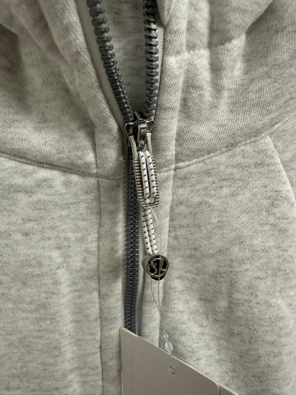 Ralph Lauren zip hoodie close-up of black-and-silver zipper pull and logo hardware