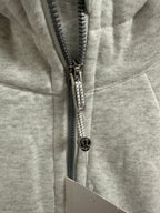 Ralph Lauren zip hoodie close-up of black-and-silver zipper pull and logo hardware