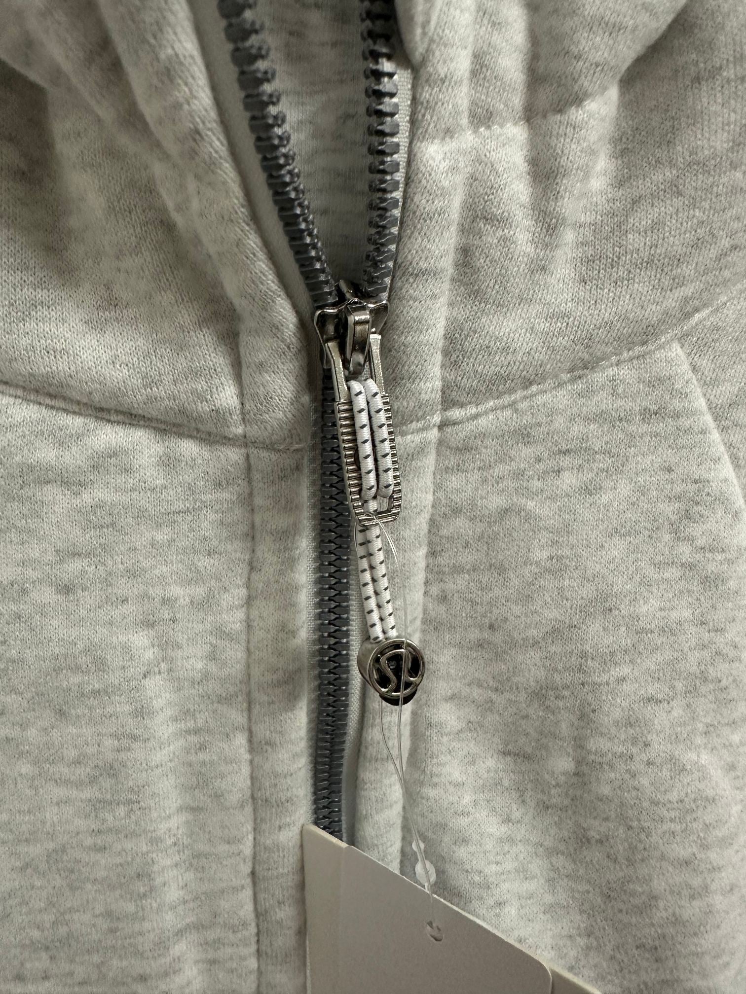Ralph Lauren zip hoodie close-up of black-and-silver zipper pull and logo hardware
