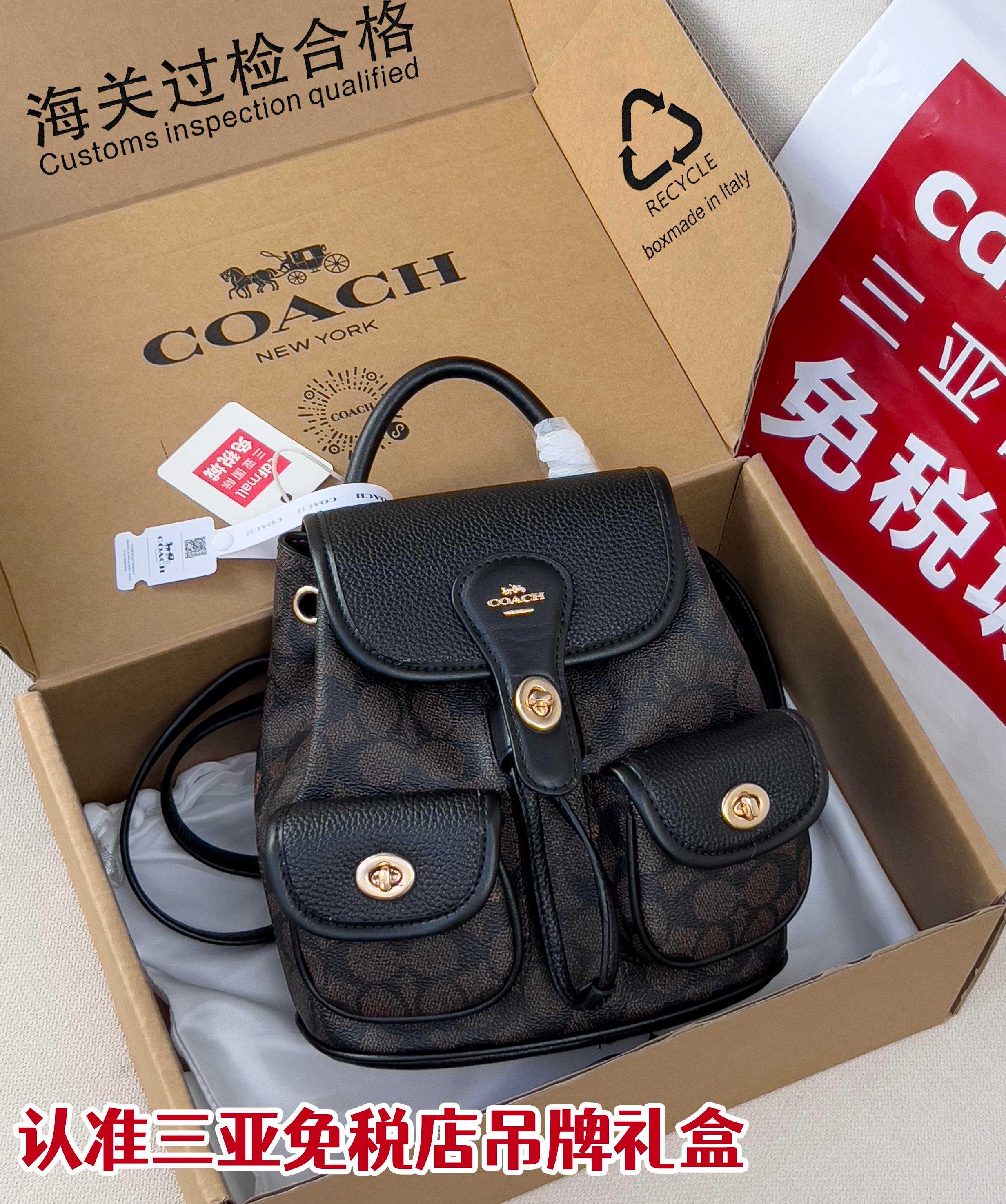 Coah mini backpack with black textured flap, front pockets, top handle, and gold hardware
