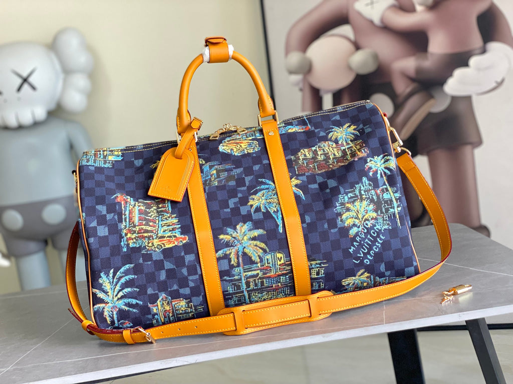 Louis Vuitton handbag in dark navy check canvas with colorful skyline print and orange trim.