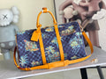 Louis Vuitton handbag in dark navy check canvas with colorful skyline print and orange trim.
