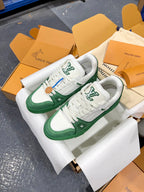 Green-and-white Louis Vuitton trainer with white laces and side LV emblem