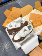 Louis Vuitton trainer sneakers, white uppers with brown midsole and star side detail