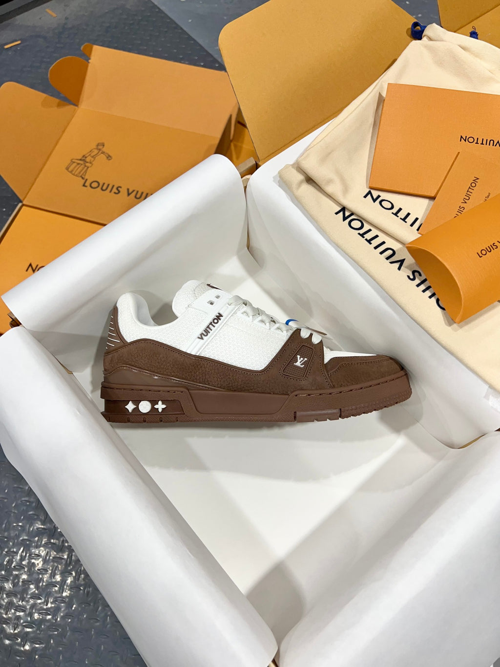 Louis Vuitton trainer sneakers, white upper with brown sole and lace-side emblem