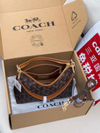 Coah monogram crossbody bag with tan strap and gold-tone clasp hardware