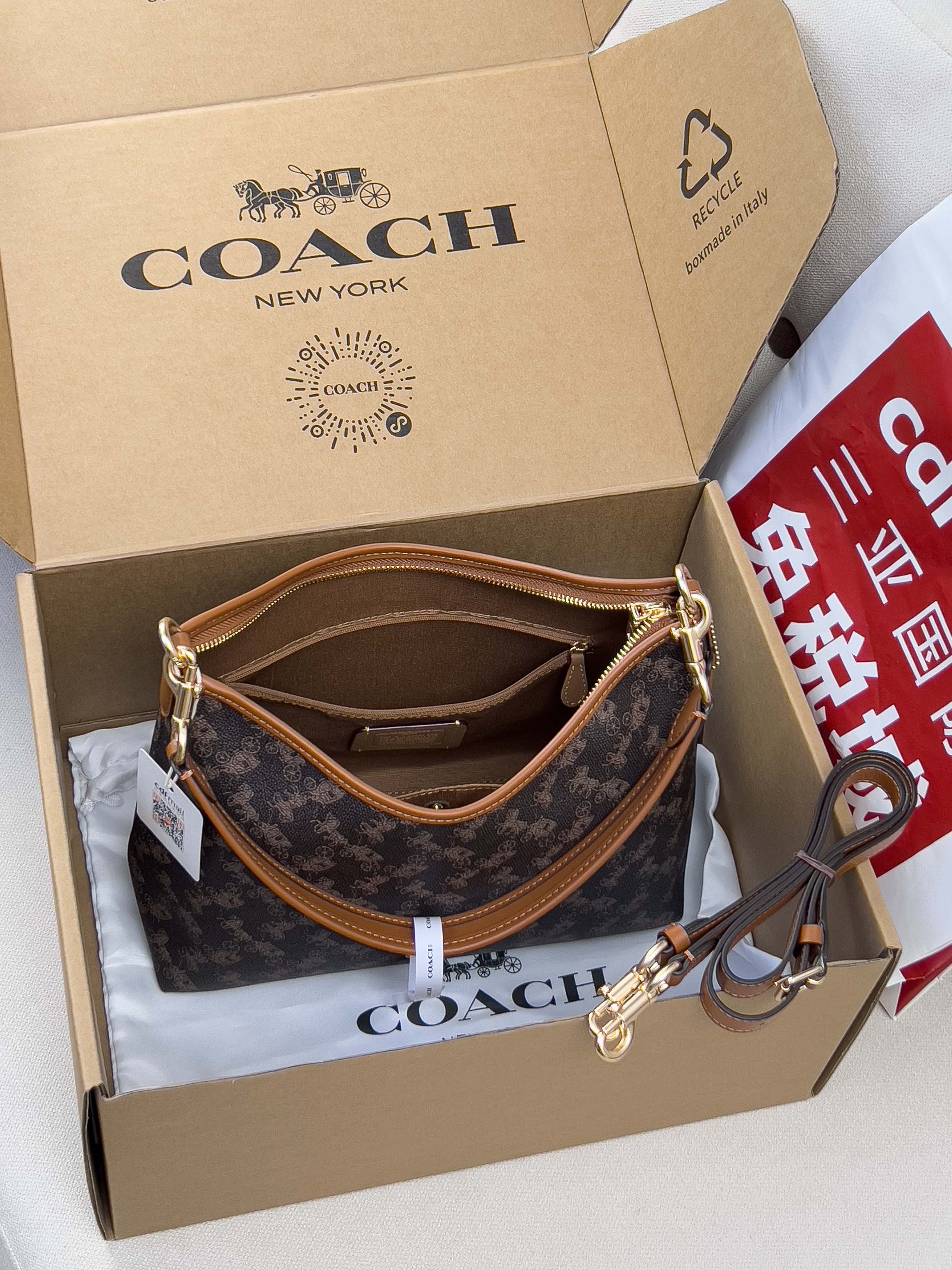 Coah monogram crossbody bag with tan strap and gold-tone clasp hardware