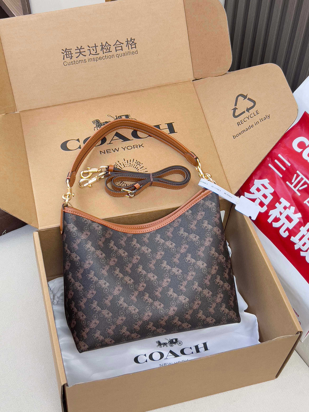 Coah monogram shoulder bag with tan leather trim and gold-tone hardware