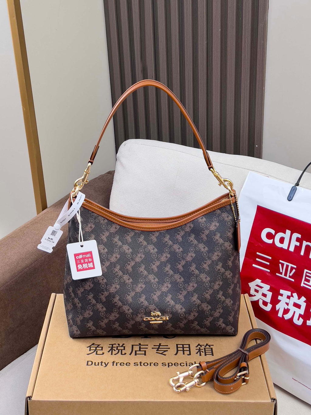 Coah monogram shoulder bag with tan handles and gold-tone hardware